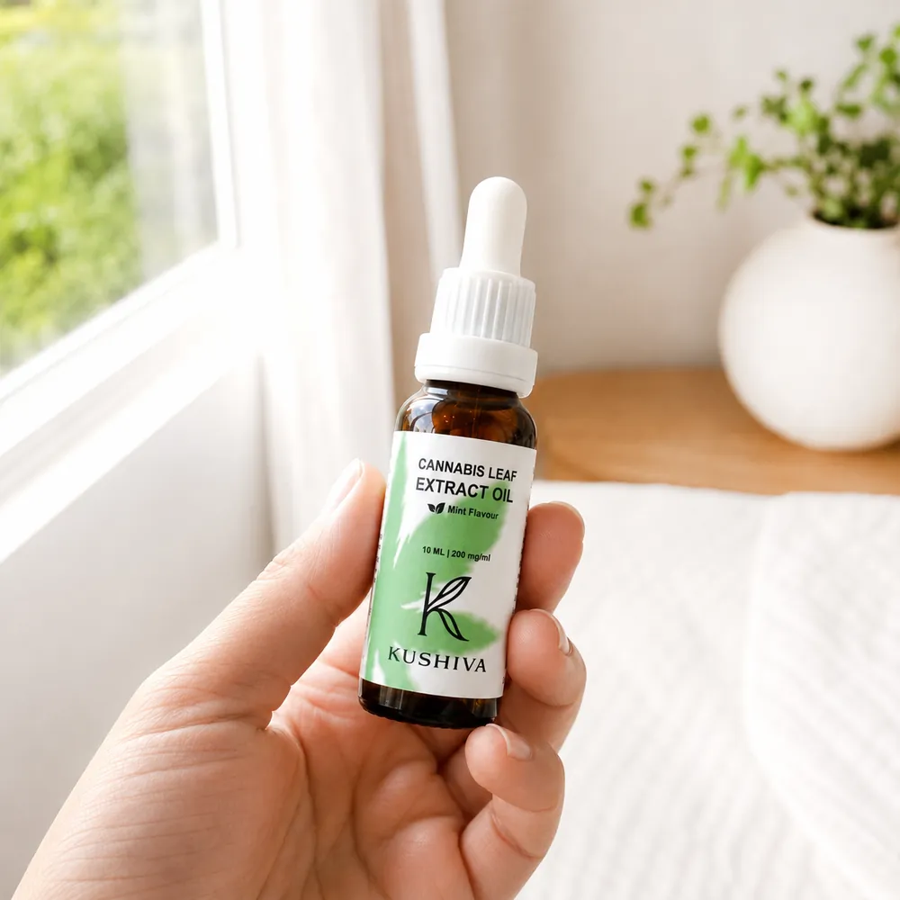 The Kushiva Cannabis Leaf Extract Oil 10 ml bottle held in one hand, showing how small the bottle is