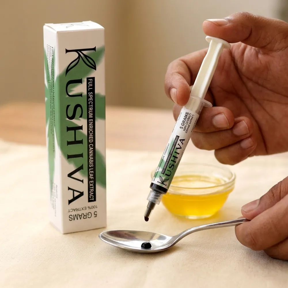 Dispensing a rice-grain amount of Kushiva full-spectrum cannabis leaf extract from the applicator onto a spoon