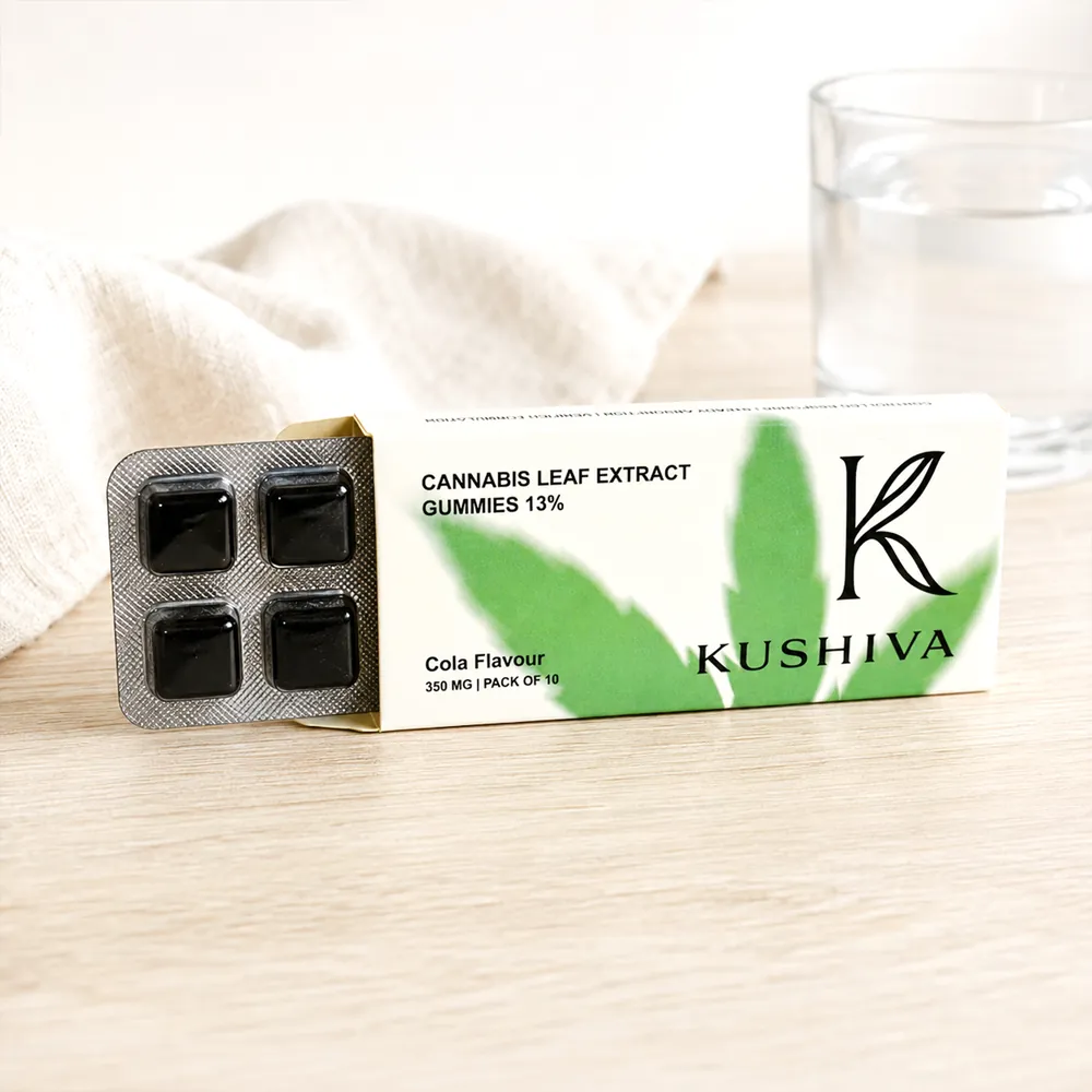 Kushiva cola cannabis leaf extract gummies blister sliding out of its pack-of-10 carton